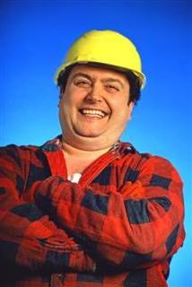 Stout man in hard hat laughing