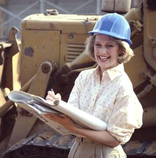 Laughing woman on construction site