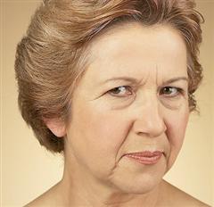 Woman frowning sceptically