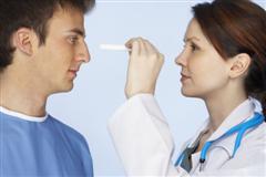 Doctor doing health check on man