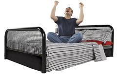 Man getting out of bed happy