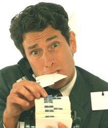 Man overwhelmed with business cards