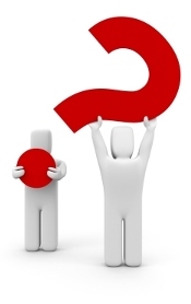 Two clay figures holding up a question mark