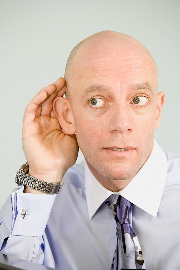 Man listening hand to ear