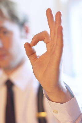 Man making OK circle with fingers