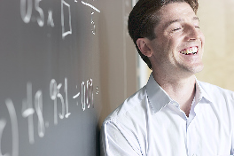 Male teacher laughing