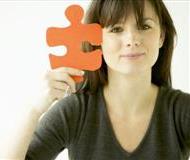 Woman Holding Jigsaw Piece