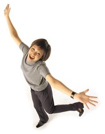 Girl laughing with hands raised