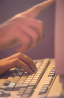 hands with keyboard and monitor