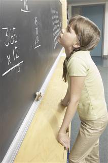 Girl Reading Blackboard