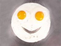 fried egg with cut-out smile