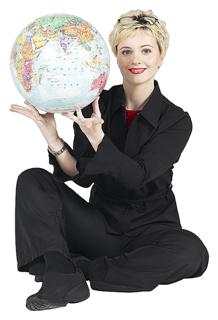 Woman holding a world globe and smiling