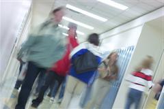 Blurred photo of students in school corridor